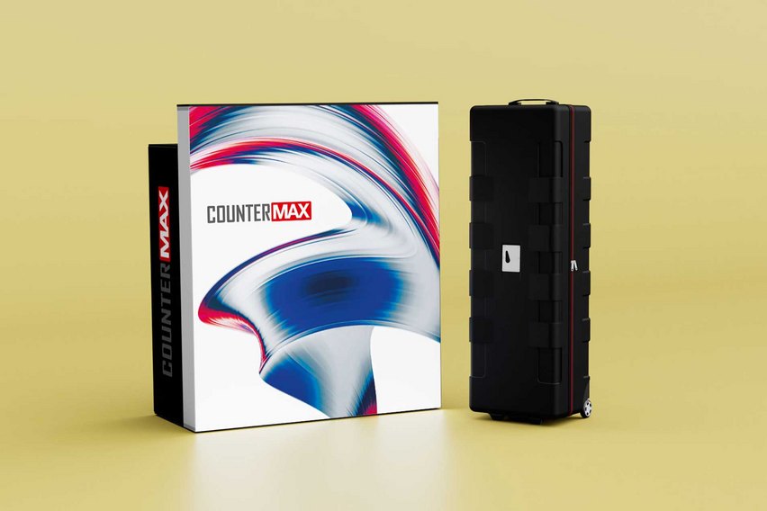 Ein schwarzer Koffer steht neben einer weissen Verpackung mit dem Aufdruck "COUNTERMAX".